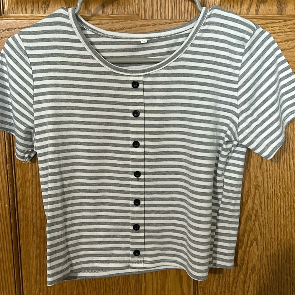 Grey stripped crop top size L with buttons. Never worn. No stains or tears.